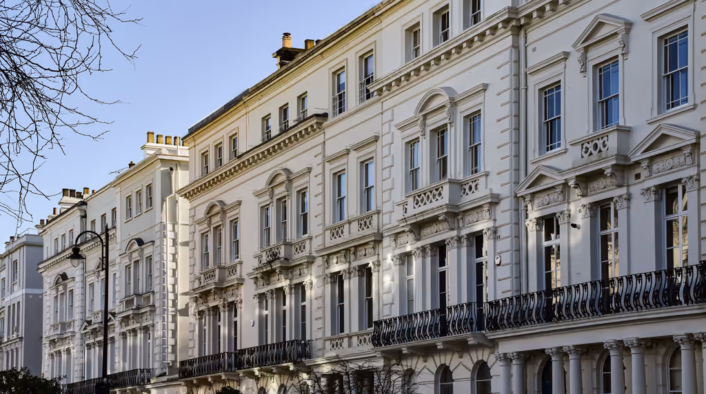 A row of white stucco terraced houses in London